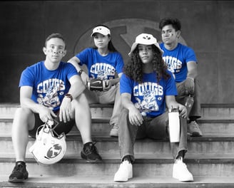 a group of people sitting on steps with a soccer ball