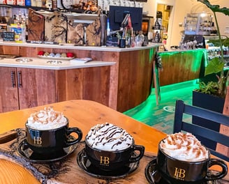 three cups of coffee in a restaurant