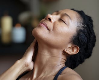 a woman with her hand on her neck