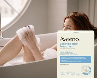 woman taking a bath using Colloidal Oatmeal