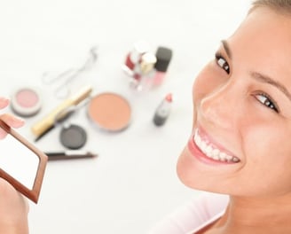 a woman holding a mirror in her hand