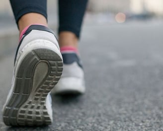 a person walking on a sidewalk