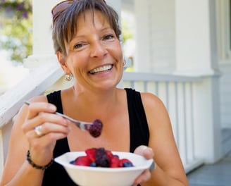 woman eating berries