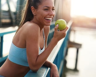 woman holding an apple