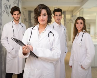 a group of doctors and nurses in white coats and lab coats