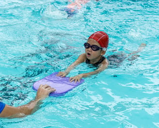 child learning to swim