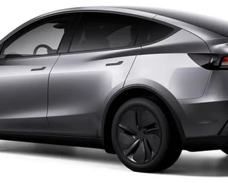 a silver tesla model with a rear view of the vehicle