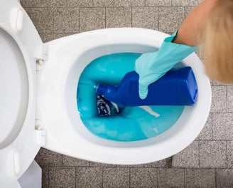 overused wasted liquid toilet cleaner creating a messy toilet