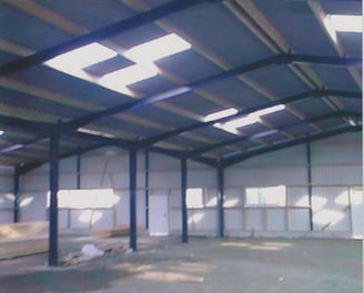 a large open space with a long metal structure