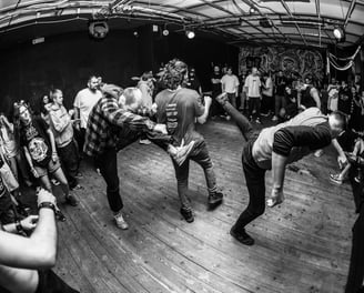 black and white photo fans at hardcore show