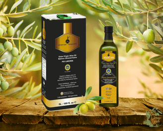 Spartan Treasure extra virgin olive oil tin and bottle with fresh olives on wooden surface.