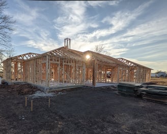 a house being built with a wooden frame