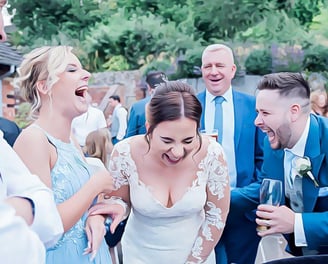 guests laughing at magician