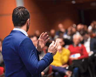 A speaker giving public speaking training