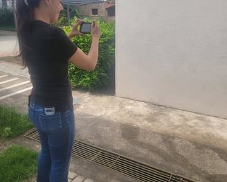 a woman is taking a picture of herself in the street
