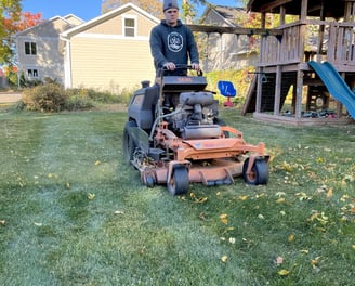 oja-lawn-and-landscape-employee-on-a-mower.jpg