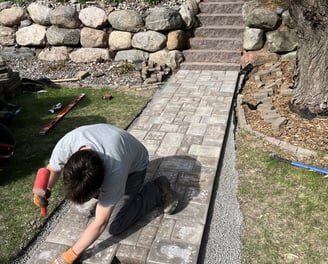 man-building-custom-walkway.jpg