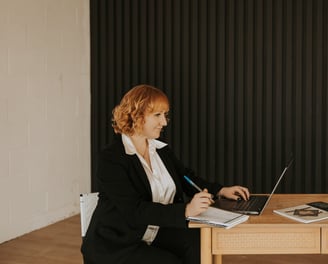 Stony Valley Business Services employee working at a laptop doing bookkeeping