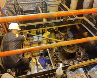 A CMS technician working on a steam turbine.