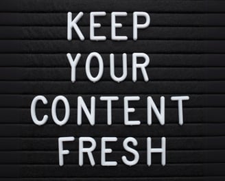Lettering says Keep your content fresh, used to represent content creation services.