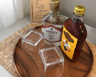 a tray of liquor bottles and liquor glasses