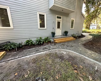 a house with a wooden deck and a wooden deck