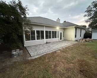 a backyard patio with a patio with a patio area