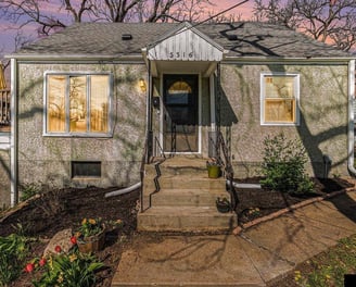 a house with a front porch and a front door