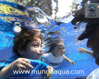 two little boys swimming in the water