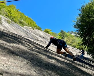 Climbing during a team building in Val di Mello