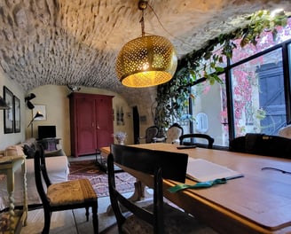 a dining room with a table and chairs