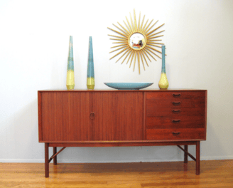 a dresser with vases and vases on it