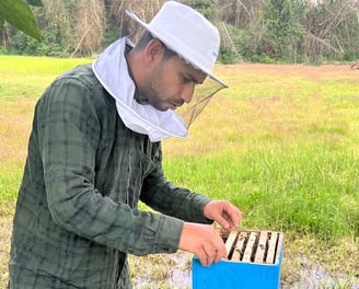 beekeeper from Nilgiris forest background green and yellow