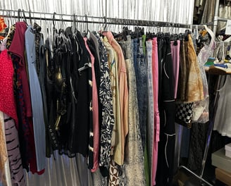 a rack of clothes and clothes hanging on a rack