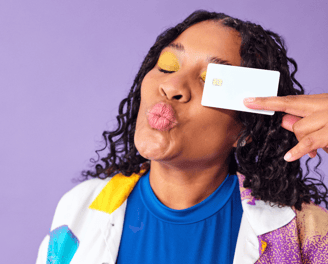 College student holding campus credit card for cashback and no annual fee