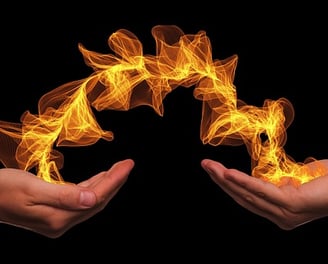 two hands holding a firework in the shape of a circle