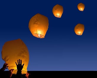 Lamps floating in the sky.