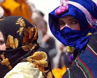 a woman in a blue scarf and a man in a black suit
