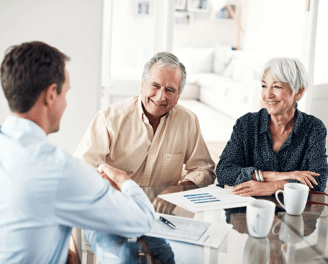 Senior couple meeting with an estate planning advisor to secure their legacy with Guarded Legacy.
