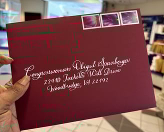 Custom calligraphy on burgundy envelope