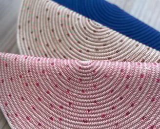 a pair of straw hat with polka dot dots on it