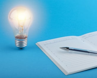 a pen and a pen on a notebook with a pen and a pen