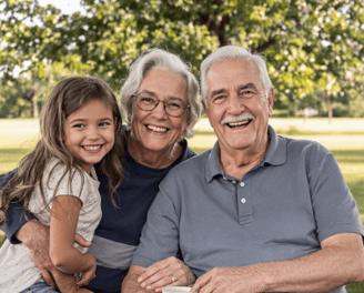 A picture of a elder couple with a child.