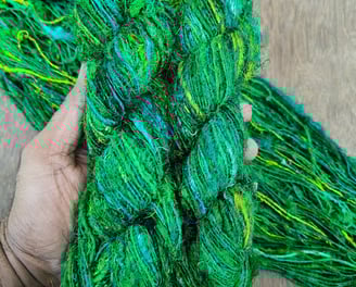 Our Premium Sari Silk Handspun Yarn is vibrant, exotic and made from 100% recycled sari silk remnant
