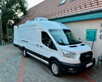 a van parked in front of a building