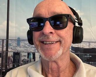 A picture of Robert Brian Follett, host of The Robert Brian Podcast wearing headphone with mic