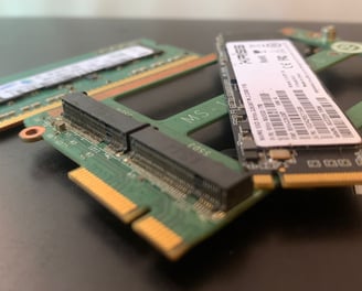 a couple of ram modules are sitting on a table