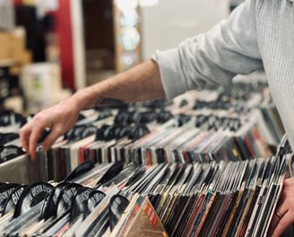 Person crate diving through vinyl records