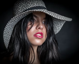 a woman with a hat on her head