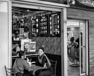 Peter Pickering' captures two girls having coffee outside a Perth cafe